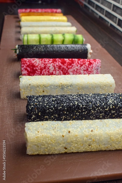 Fototapeta Set of other types of sushi on the table