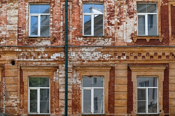 Fototapeta Fragment of old building with and windows