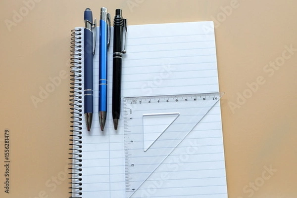 Fototapeta Office supply. Ready for school or work. Pen, paper and ruler. Take notes.