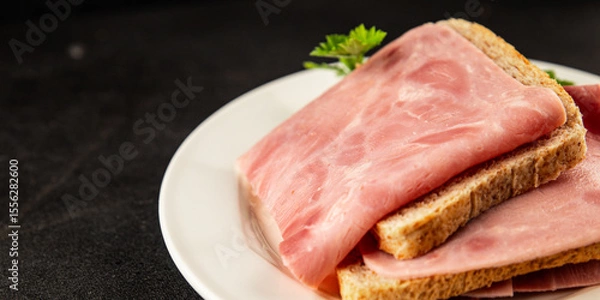 Fototapeta Sandwich ham slices meat spam pork fresh delicious gourmet food background on the table rustic food top view copy space