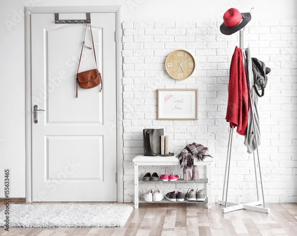 Fototapeta Modern hall interior with hanging clothes