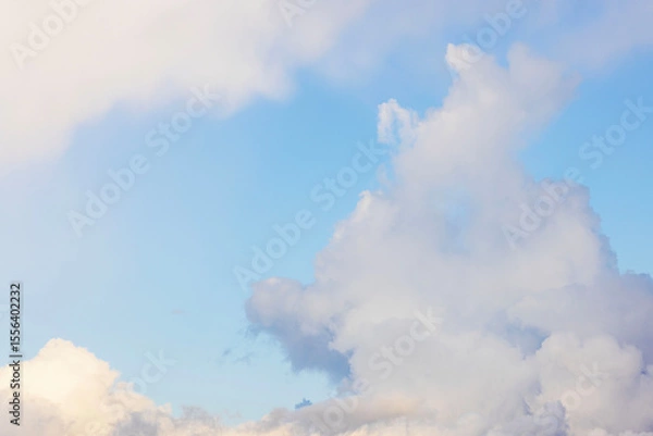 Fototapeta Blue sky with soft white clouds on bright sunny day in peaceful weather with clean atmospheric view. Sweden.