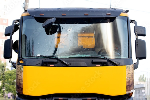 Obraz Yellow truck front with damaged windshield