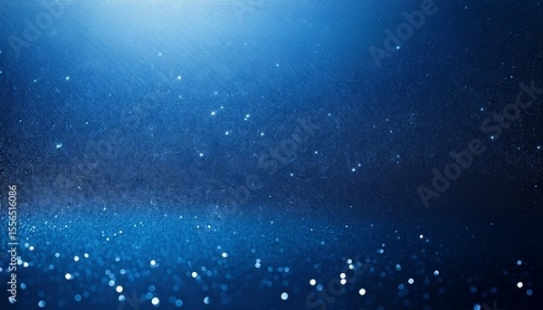 Fototapeta a rich deep blue background with a subtle sparkling texture of fine particles the smooth gradient and shimmering light evoke a sense of depth and elegance