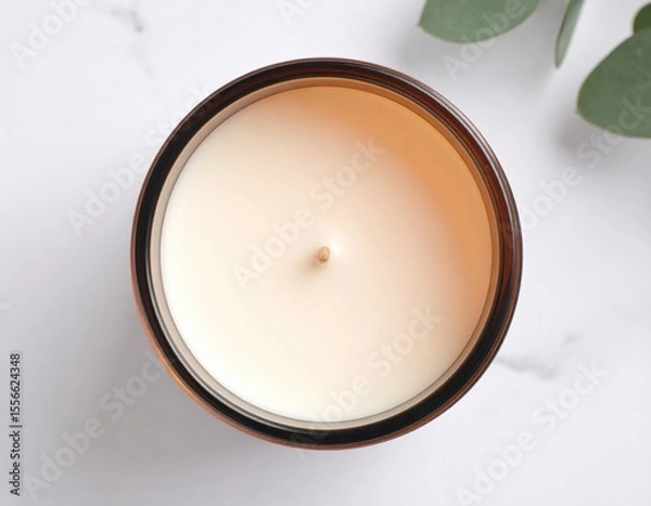 Fototapeta Top View Of A Round Amber Candle