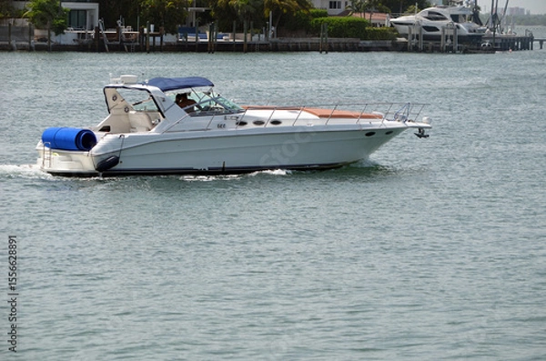Fototapeta High end cabin cruiser on the Florida Intra-Coastal Waterway off of Miami Beach