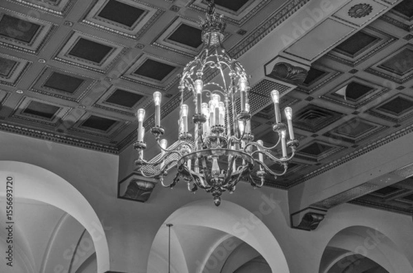 Obraz Gold Chandelier with a Art Deco Ceiling Background in Black and White.