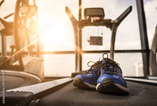 Fototapeta Running shoes on the Treadmill in Fitness Room at the Morning