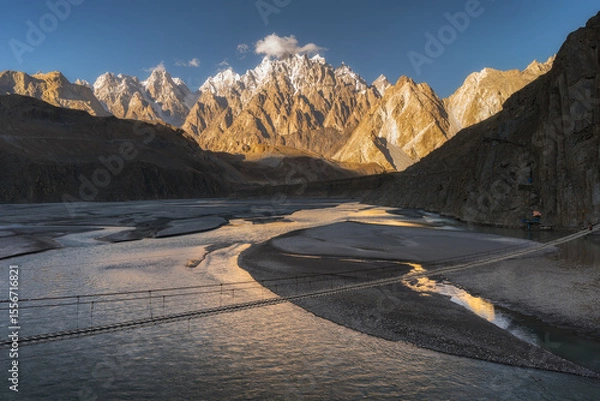 Obraz Suspension Bridge over River with Karakoram Mountains at Sunset, Pakistan