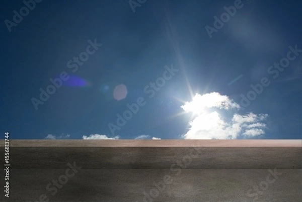 Obraz Cloud cluster is glowing under bright sun atop concrete ledge, casting lens flare in flat design