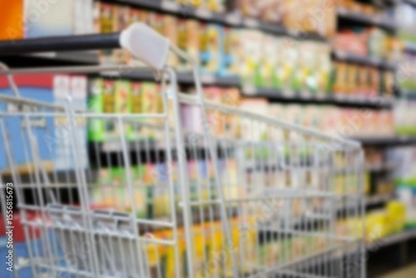 Obraz Shopping cart amidst products