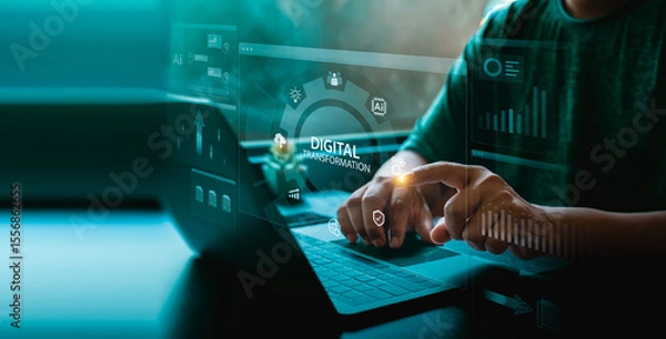 Obraz Digital transformation interface on a laptop screen with user touching holographic dashboard, AI icons, charts, and glowing blue data panels representing innovation and smart business technology