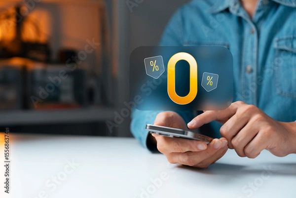 Fototapeta Zero percent interest promotion concept with Young man a hand using smartphone and glowing 0% sign, representing online shopping, finance deals, and digital discount campaigns.