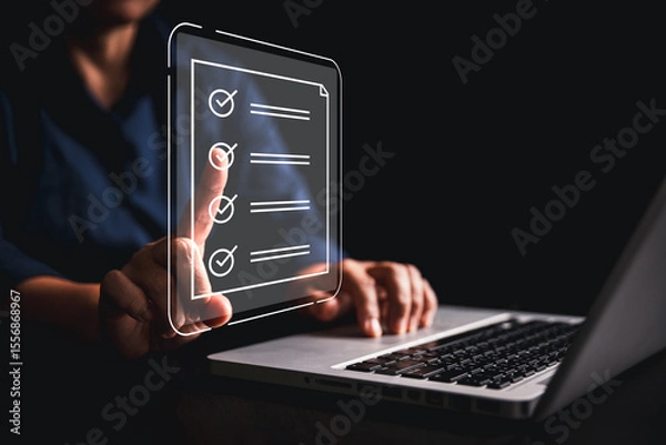 Fototapeta Woman using tablet, laptop futuristic digital interface icons manages checklist online quality control document management system streamlining workflow approval, advanced concept of modern efficiency