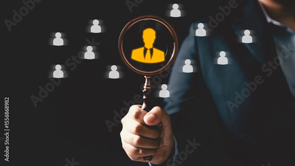 Fototapeta Concept of human resource recruitment visuals of magnifying glass highlighting ideal candidate icon, symbolizing process of headhunting, talent acquisition, employee selection, effective hiring.