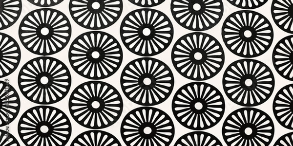 Fototapeta Seamless pattern of black sunburst flower shapes on a white background