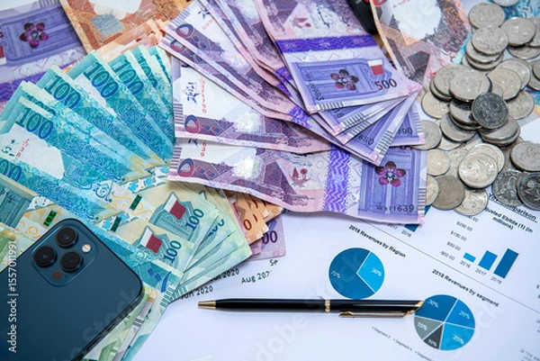 Fototapeta Doha, Qatar - June 07, 2025: Qatar Currency Bank Notes. Qatari Riyal ,Notes,500,200,100,50,10,5,1 on isolated background. Business and Finance Concept