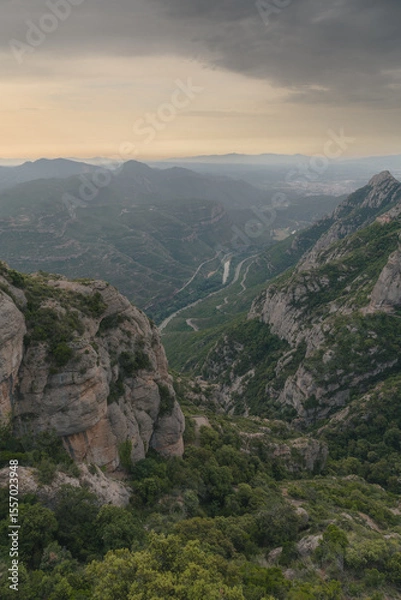 Fototapeta Montserrat mountain range in Spain near Barcelona in the Catalan Mountains. Mountain landscape with valley in the background. Vertical view