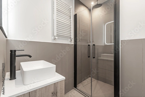 Fototapeta Modern faucet design is characterized by clean lines, pure geometric shapes