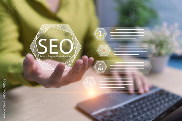 Fototapeta Virtual SEO Concepts in the Hands of Businesswomen Optimizing Websites for Easy Searching Increase Business Opportunities to Reach Target Groups and Become More Known Online Marketing Strategies