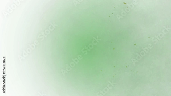 Fototapeta A lush emerald green background with floating golden particles creates an elegant and mysterious mood perfect for atmospheric designs.