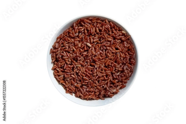 Fototapeta Top view of a white bowl filled with cooked brown rice isolated on white background.          