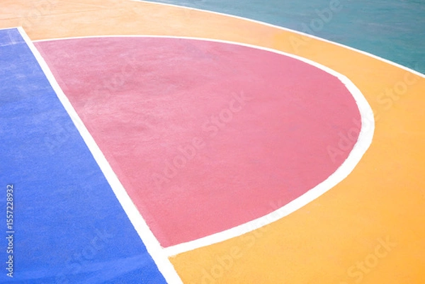 Fototapeta Outdoor basketball court background with colorful pattern and white outline on concrete floor surface, High angle view with copy space