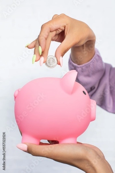 Obraz Utilizing a Piggy Bank for Saving Money A Modern Financial Concept for All Ages and Purposes