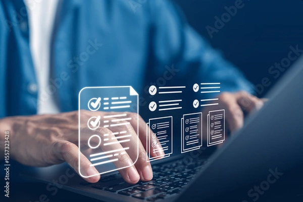 Obraz Digital document checklist and online survey form concept. User interacting with digital forms on a laptop, showing task approval and checklist workflow for productivity and data submission systems.