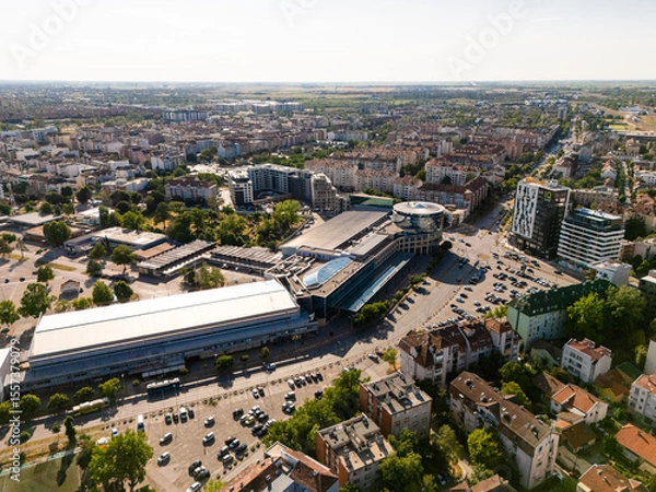 Fototapeta Novi Sad, Serbia - June 27, 2025: Aerial view of the settlements Sajmiste in Novi Sad and fair building
