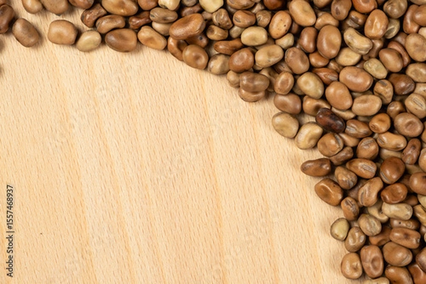 Fototapeta Whole dried raw uncooked vicia faba beans close-up