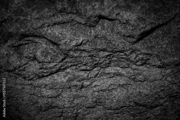 Fototapeta  Black white rock background. Mountain surface close-up. Dark stone texture. 