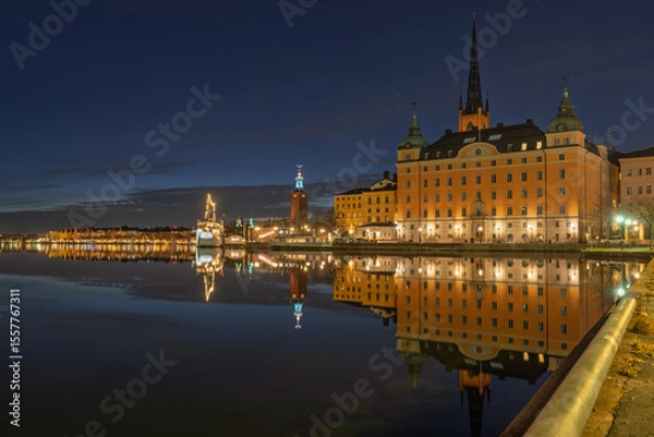 Fototapeta Night view of AF Chapman ship and Riddarholmen in Stockholm with reflections