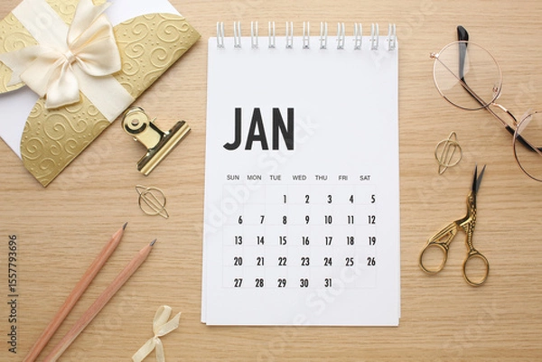 Fototapeta Desktop calendar on a modern desktop. Schedule and time planning in office and business.