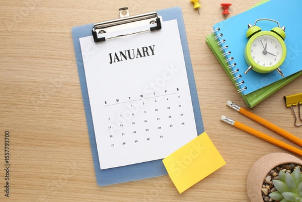 Fototapeta Desktop calendar on a modern desktop. Schedule and time planning in office and business.