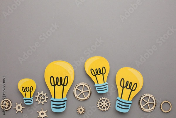 Fototapeta Creative thinking ideas and innovation concepts. Yellow coloured light bulb on the background