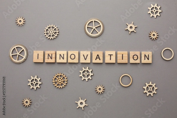 Fototapeta Innovation lettering on grey background with gears