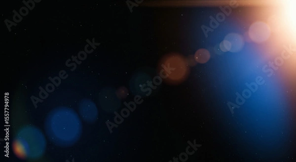 Fototapeta Blue light leaks and gradient over an abstract grainy background. Grainy colorful warm blue light leaks on a black background with a dust texture. Blue wavy abstract background for presentation	