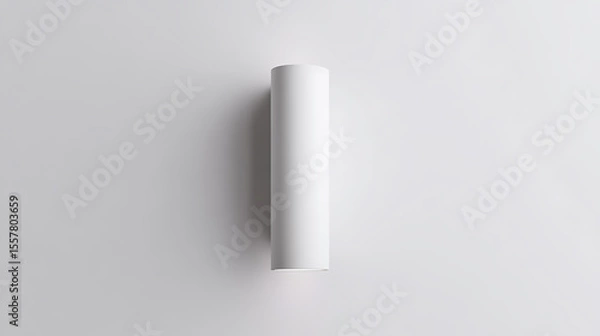 Fototapeta Sleek white cylinder flush-mount wall light with soft shadows on a light gray wall, minimalist design, modern interior lighting, elegant simplicity.
