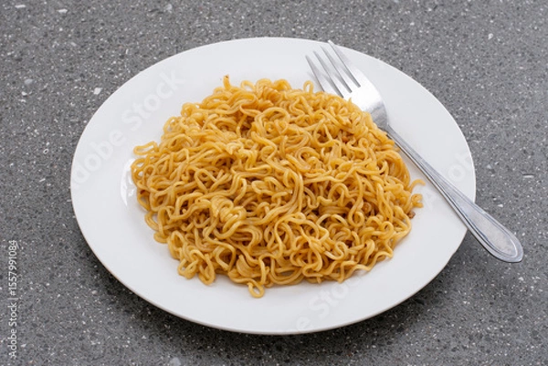 Fototapeta Fried instant noodles with fork