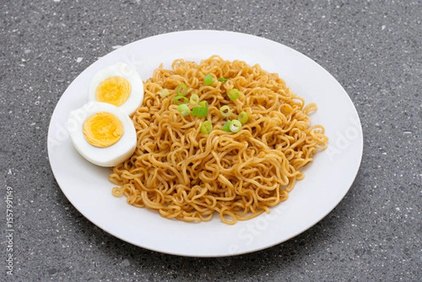 Fototapeta Fried instant noodles with boiled eggs