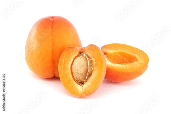 Obraz Fresh Ripe Apricots Whole and Sliced on a White Background