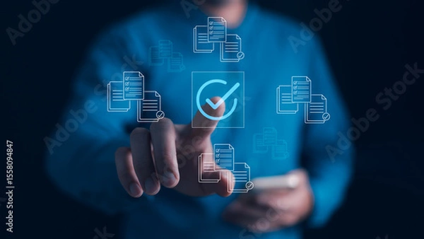 Fototapeta Compliance Document Approval Concept. Hand points to checkmark icon digital document indicating successful verification, task completion, quality control, efficient process management for business.