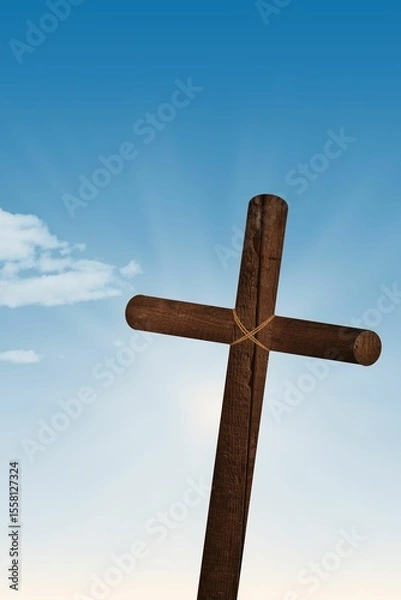 Fototapeta Flat design is showing rope-bound wooden cross standing in blue sky with sun rays, small cloud