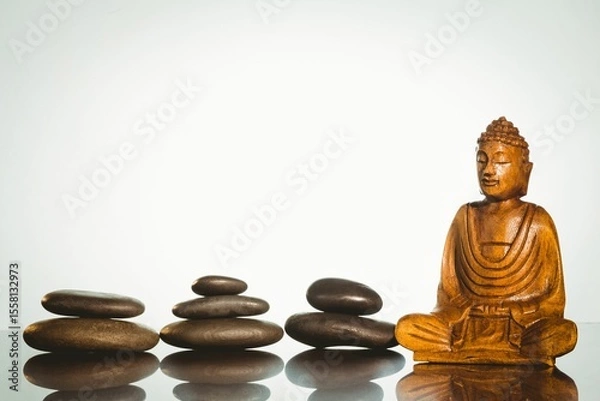 Obraz Buddha statue with stacked stones