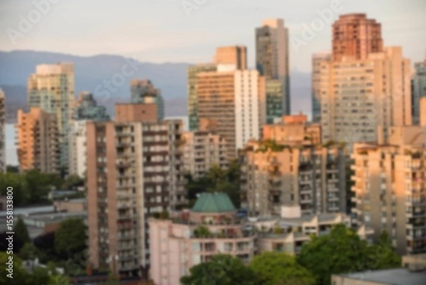 Fototapeta Blurry view of cityscape during summer