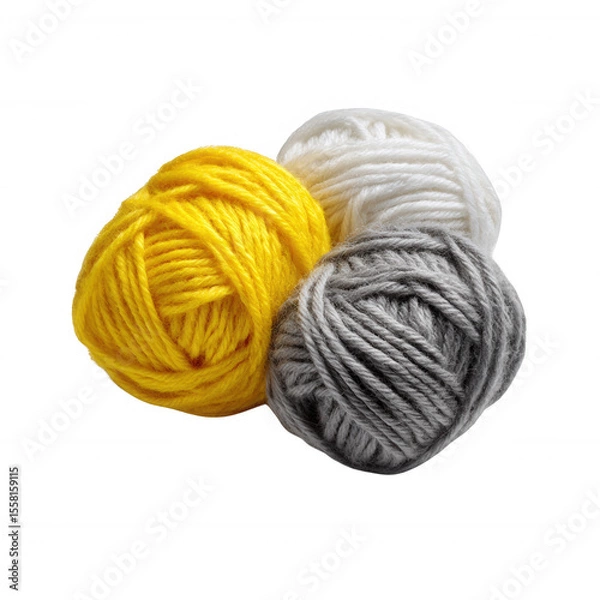 Fototapeta Three colorful balls of yarn, featuring vibrant yellow, soft white, and gentle gray shades, arranged artistically for crafting and knitting enthusiasts.
