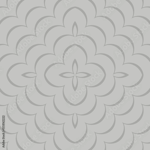 Fototapeta A symmetrical pattern features overlapping floral shapes and geometric motifs in a monochromatic color scheme. The design is intricate, with a repetitive arrangement creating a sense of harmony.
