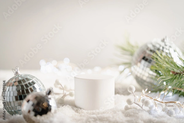 Fototapeta Winter Christmas composition with geometric shapes podiums and christmas decorations in snow. Empty pedestal for product presentation and for advertising display