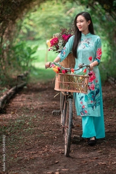 Obraz Young Vietnamese Girl with Bicycle Surrounded by Lush Nature